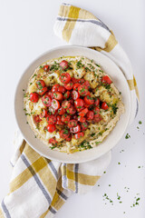 Roast cauliflower tomatoes and hummus salad