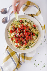 Roast cauliflower tomatoes and hummus salad