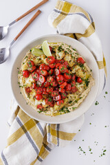 Roast cauliflower tomatoes and hummus salad