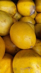 Close up pile of tasty fresh limes sold at the market as a background.