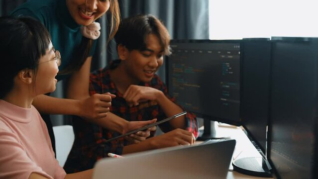 Back end software developer engineer for computer programming working together on debugging writing computing code, solving complex algorithms display on monitor in office. Burgeoning