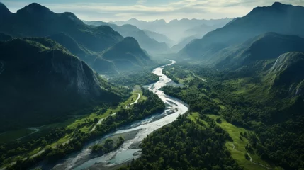 Fototapeten Aerial view of a curvy river and majestic mountains © stocksbyrs