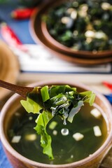 Kelp is an edible marine algae and is served as a cold dish on the table mixed with the spicy millet condiment