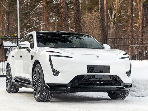 Novosibirsk, Russia - February  21 , 2024:     white Avatr 11 parked  against park,  front view