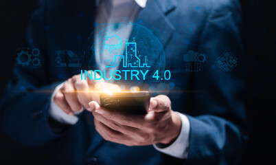 Smart factory automation and industry 4.0 concept. Smart industrial revolution, automation, robot assistants, iot, cloud and big data. Businessman connected industry 4.0 on smartphone.