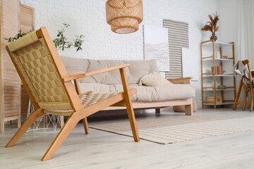 Wooden armchair in interior of light living room