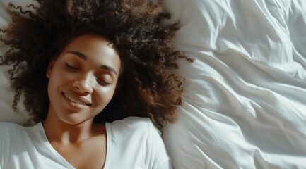 Smiling african american woman sleeping on white bed with copy space