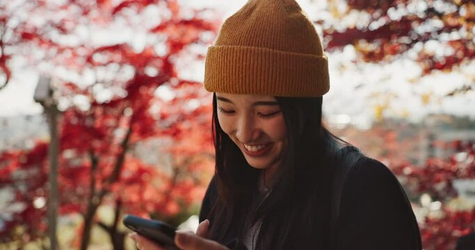Selfie, travel and Japanese woman in forest for holiday, vacation and adventure in Japan. Happy, smile and person take picture on smartphone in nature for social media post, memories and online blog