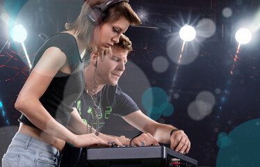 DJs' profiles highlighted by performance's dynamic lighting