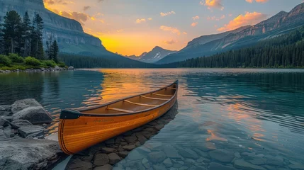 Foto op Canvas parked sailing boat Wood canoe on the edge of Bowman Lake at sunrise in Glacier National Park. © haizah