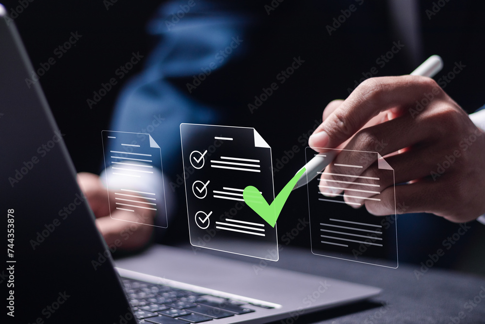 Poster quality document control checklist and business approve project concept. businessman use laptop to t