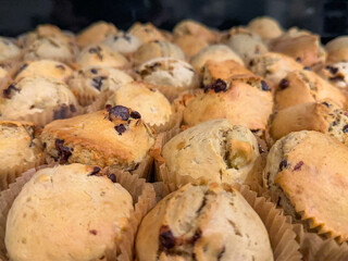 Close-up shot of a large batch of chocolate chip muffins 