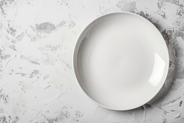 empty white plate on marble table