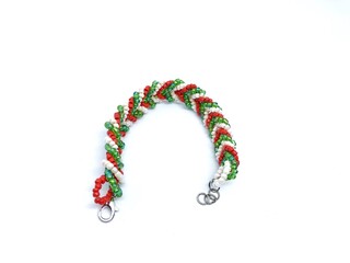 Beaded bracelet with Christmas motif on white background