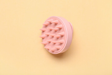 Hair scalp massager on orange background