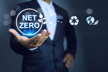 Net zero concept with businessman holding environment icon to encourage reduce co2 activity...