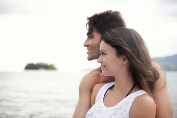 Couple, embrace and travel to ocean on vacation, love and relax by water on summer holiday. People, peace and bonding for relationship in outdoors, support and hug on weekend trip to sea or nature