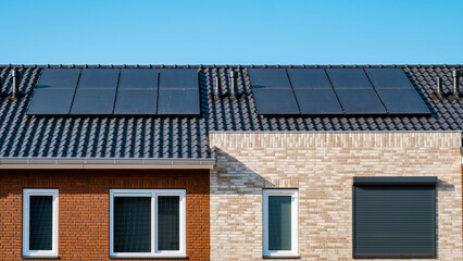 Close up of new building with black solar panels. Zonnepanelen, Zonne energie, Translation: Solar...