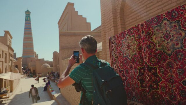 Man tourist at street market in Khiva