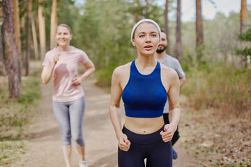 People jogging in the forest