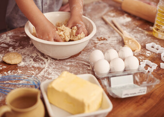 Children, baking and hands in kitchen with dough, home and learning with ingredients for dessert...