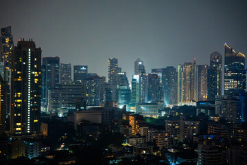 Fototapeta na wymiar Bangkok skyline view at night from a rooftop restaurant, Bangkok Thailand