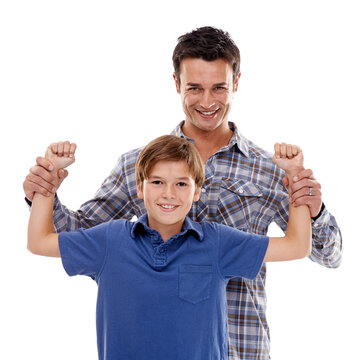 Family, muscle and portrait of father with boy on a white background for bonding, happy and love. Smile, parenthood and face of dad flex with son for support, care and playing together in studio