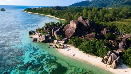 Zelfklevend Fotobehang Anse Source D'Agent, La Digue eiland, Seychellen Drone top view at Anse Source d'Argent beach La Digue Island Seychelles, Drone aerial view of La Digue Seychelles, tropical vacation summer holiday, a beach with huge granite rocks at sunset