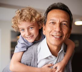 Portrait, senior citizen and boy with smile, piggyback and bonding together in multiracial family. Happy, retired male person or young kid for sweet, hug and embrace with love, cheer and care at home