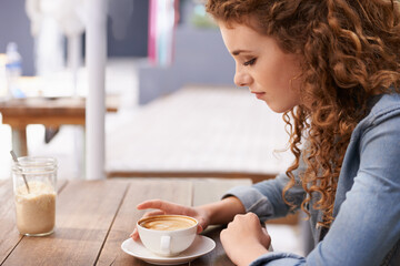 Woman, thinking and coffee at outdoor cafe, latte and relax with day dream and idea for job. Female...