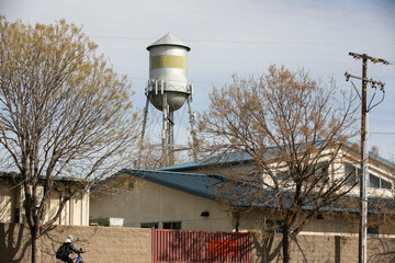 Tracy, California, USA - April 17, 2023: Afternoon sun shines on the historic downtown Tracy Water tower.