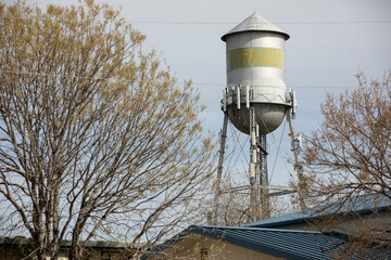 Tracy, California, USA - April 17, 2023: Afternoon sun shines on the historic downtown Tracy Water...