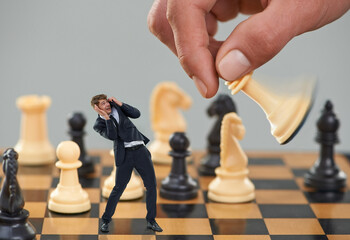 Man, business and chess with strategy, risk and fear for career safety or attack. Worker, scared...