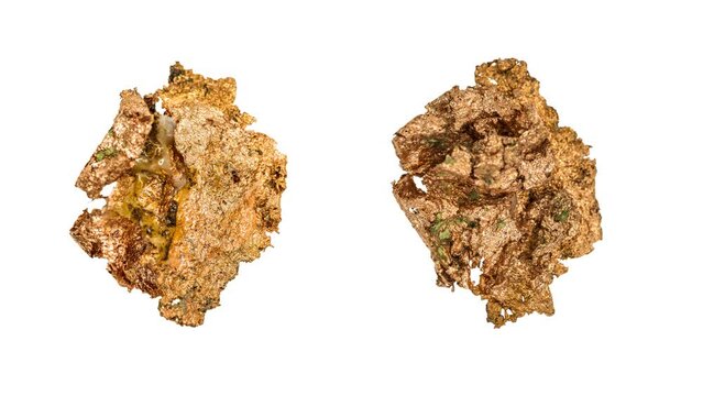 copper nuggets, turning slowly against each other on a white background