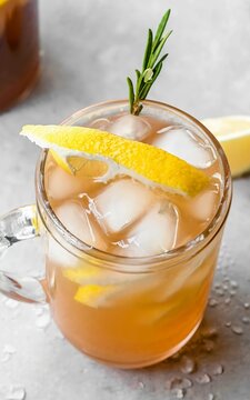 Iced lemon tea with lemon on top of glass