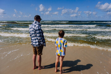 Father and son at the summer beach