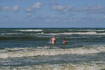 Son and father at the sea