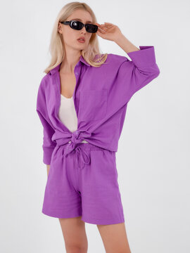Beautiful fashionable girl in a summer suit. Clothes catalogue. White background. Fashion catalog
