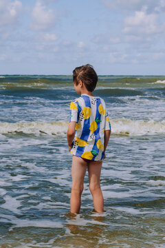 Happy kid boy at the summer beach