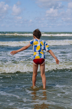 Happy kid boy at the summer beach