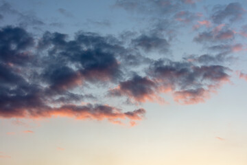 Naklejka na ściany i meble Beautiful clouds at sunset as a background