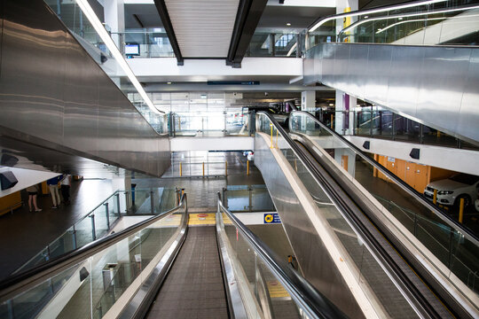 Looking Down On Layers Of Escalator Going Up And Down