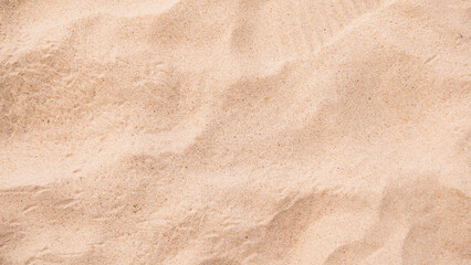 Fototapeta na wymiar Background image of fine sand at the beach for adding desired text.