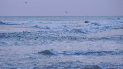 A winter view of waves in the Atlantic Ocean in Nags Head, Outer Banks, North Carolina.