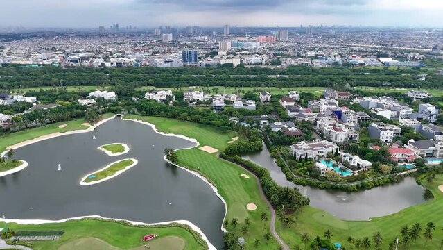 aerial view of a residential area in North Jakarta, Indonesia with a Lake and Golf Course