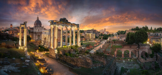 Amazing cityscape scene of the Roman Forum in Rome, Italy, at dusk, with dramatic colorful sky and...