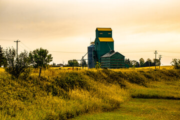 Rustic old Grain elevator sits off to the side, tracks have been deactivated, Delia, Alberta, Canada