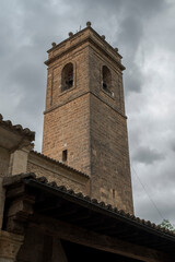 Naklejka premium Bell tower of the Church of Santa Maria de la Pena, in the city of Brihuega, province of Guadalajara, Spain. It was built at the beginning of the 13th century