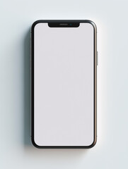 Top view of a modern smartphone with a white blank screen on a light surface for design mockups