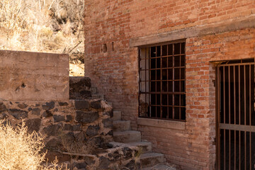 Fototapeta na wymiar Orange Brick Building Background Stone Staircase Chained Window